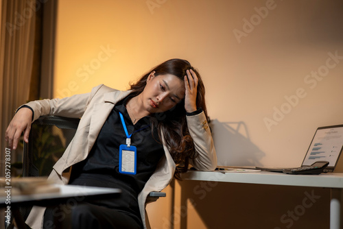 Stressed business woman feeling exhausted from overworking