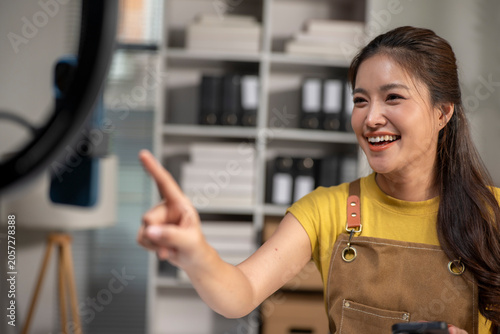 Woman streaming live event for e-commerce business