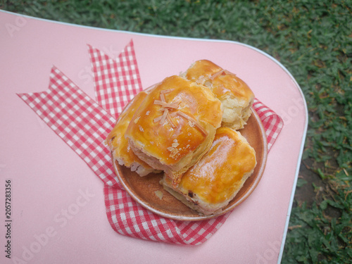 Homemade banana bolen. Banana wrapped in pastry or called banana bolen or bolen pisang. Delicious Golden Baked Pastry Bites with Cheese Topping. Indonesian pastry. 
