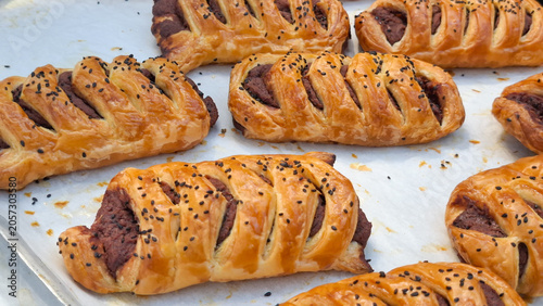 Obraz na plátně Freshly baked flaky braided puff pastry filled with sweet delicious paste fillin