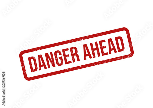 Foto Red rubber stamp with the text danger ahead in a tilted rectangle