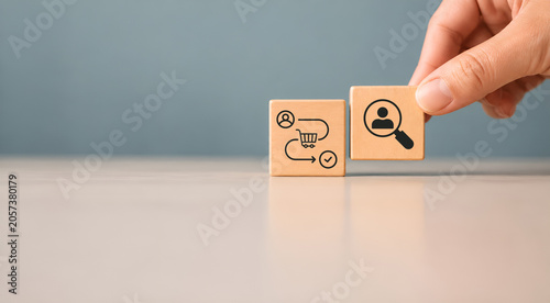 Customer behavior analysis concept. Wooden blocks with customer journey and insight customer analysis icons on minimal background. Helping business tailor strategies and improve customer satisfaction.
