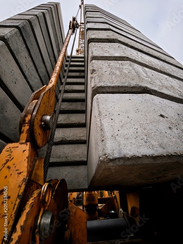 Obraz na płótnie Detailed view of concrete counterweights on a construction crane