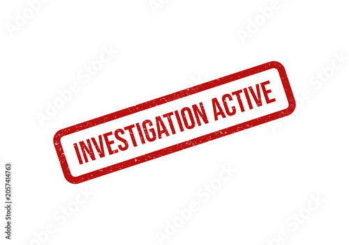 Red ink rubber stamp with the text investigation active on paper