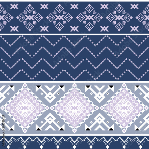Navajo Pattern Design: Intricate Navajo-inspired geometric patterns in shades of blue, gray, and white, featuring diamond shapes, zigzags, and tribal motifs.