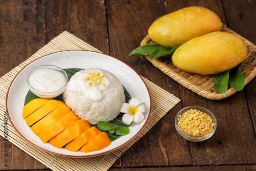 Fotografie Mango sticky rice is a Thai dessert made from sticky rice, mango and coconut milk