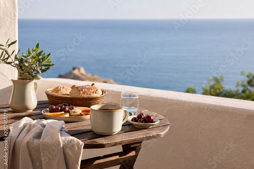 Mediterranean breakfast on a sunny terrace with sea view