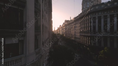 City view at sunset from high building in urban area with street below