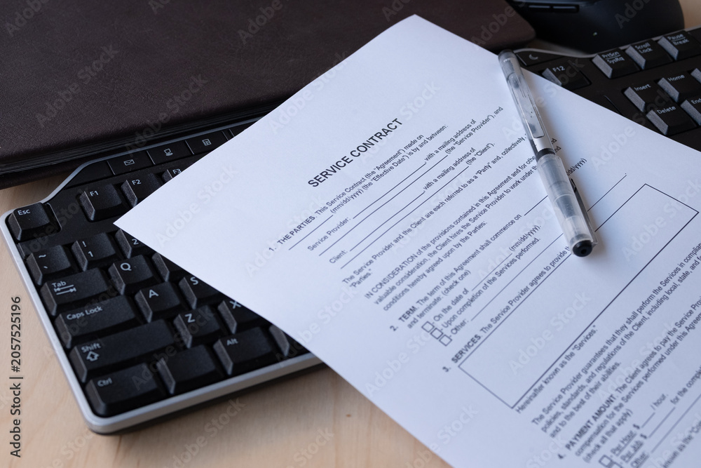 Obraz premium A printed Service Contract form with blank fields for service provider and client details, effective date, term, and parties clauses