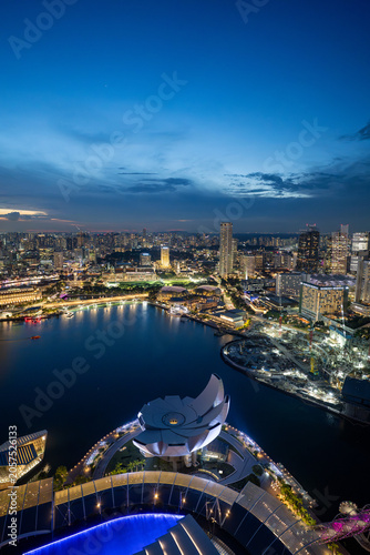 Singapore city skyline and marina at blue hour from above