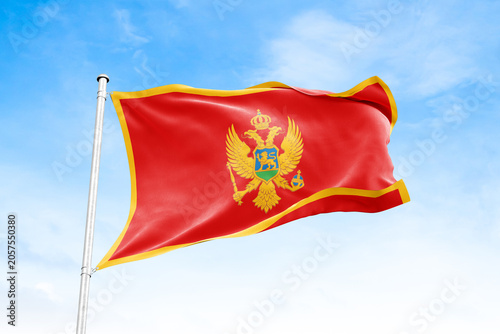 Canvas Print Montenegro national flag waving against blue sky