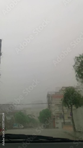a car driving through heavy rainstorm