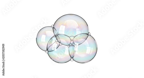 Shimmering iridescent bubbles float gently in air surrounded by calmness