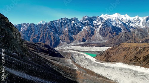 Aerial View of Glacier Lake and Himalayan Peaks During Descent from Larkya La Pass to Bimtang on the Manaslu Circuit Trek, Nepal