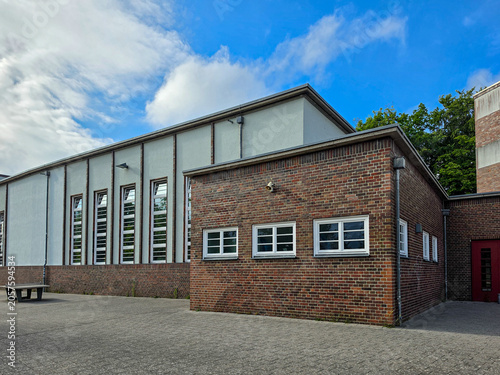 фотографія Industrial brick warehouse building with modern architecture under blue sky