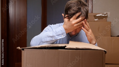 Εκτύπωση καμβά Man covering his face with hands while experiencing stress and frustration durin