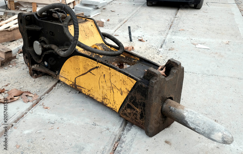 Part of heavy roadworks machinery laying on a street