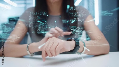 Hands in modern attire interacting with a sleek digital interface displaying abstract data, code, and rapid patterns on a luminous screen, against a blurred high-tech office desk. Concept of future