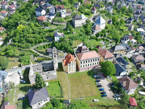 Aerial drone shot of historical Jajce town and medieval fort at top of the hill
