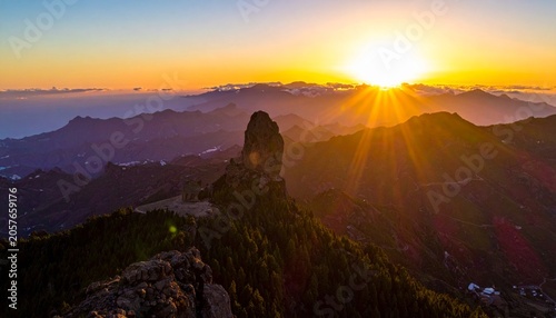 Majestic sun over rugged peaks