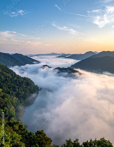 Misty river valley at sunrise