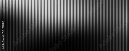 Abstract monochrome background featuring dense vertical blurred stripes in smooth black gradient, white, and gray tones, mysterious dark wave in the center