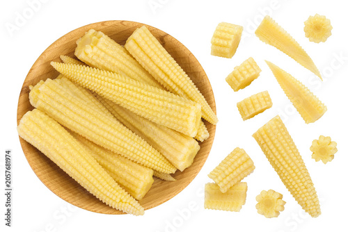 Pickled young baby corn cobs in wooden bowl isolated on white background Top view. Flat lay