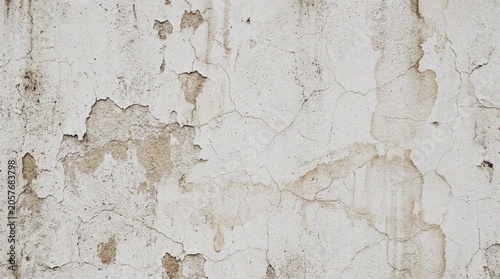 Obraz na plátně Close-up view of aged and peeling white wall texture with visible cracks and damage