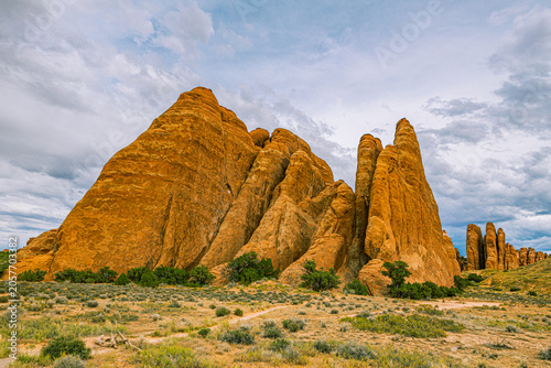 Obraz na plátně Towering monolithic sandstone fins forming a narrow slot canyon gateway at the Sand Dune Arch trailhead area in Utah