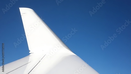 rudder. Aircraft tail fin against a blue sky, showing directional adjustment. mobility guides, transit brochures, designed for transport & logistics marketing and mobility and urban transit guides.