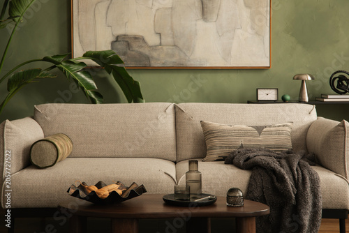 Valokuva Cozy Living Room Interior with Neutral Sofa, Green Wall, and Modern Decorations