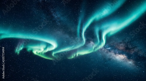 Mesmerizing celestial aurora borealis dances across the starry night sky illuminating the darkness with vibrant ethereal green and blue light creating a surreal natural spectacle visible in high