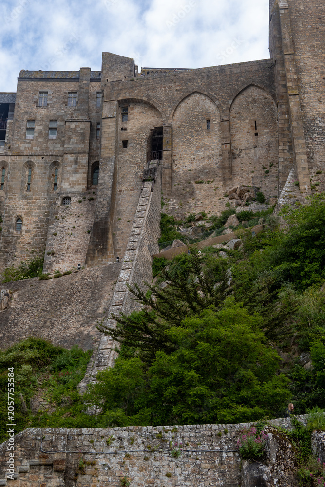 Obraz premium Architecture and buildings of Mont-Saint-Michel interior, medieval Gothic and Romanesque architecture, historic stone walls, columns, details. UNESCO heritage monument in Normandy, France