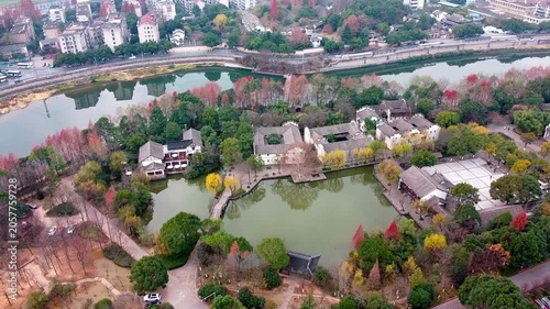 Aerial View of Traditional Chinese Garden by Riverside in Autumn