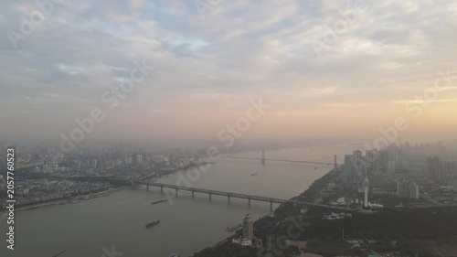 Aerial Wuhan skyline and Yangtze River bridges at sunset in Wuhan, China