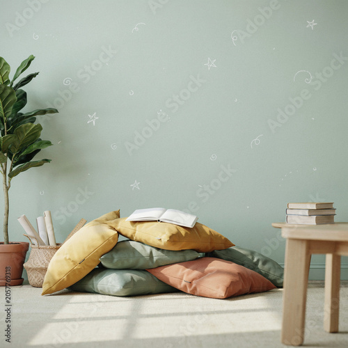 Pillows are stacked neatly on the floor next to a tall potted plant against a wall adorned with delicate stars.