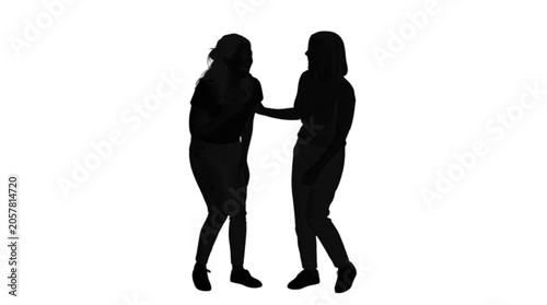 Two people embracing and walking together silhouette style