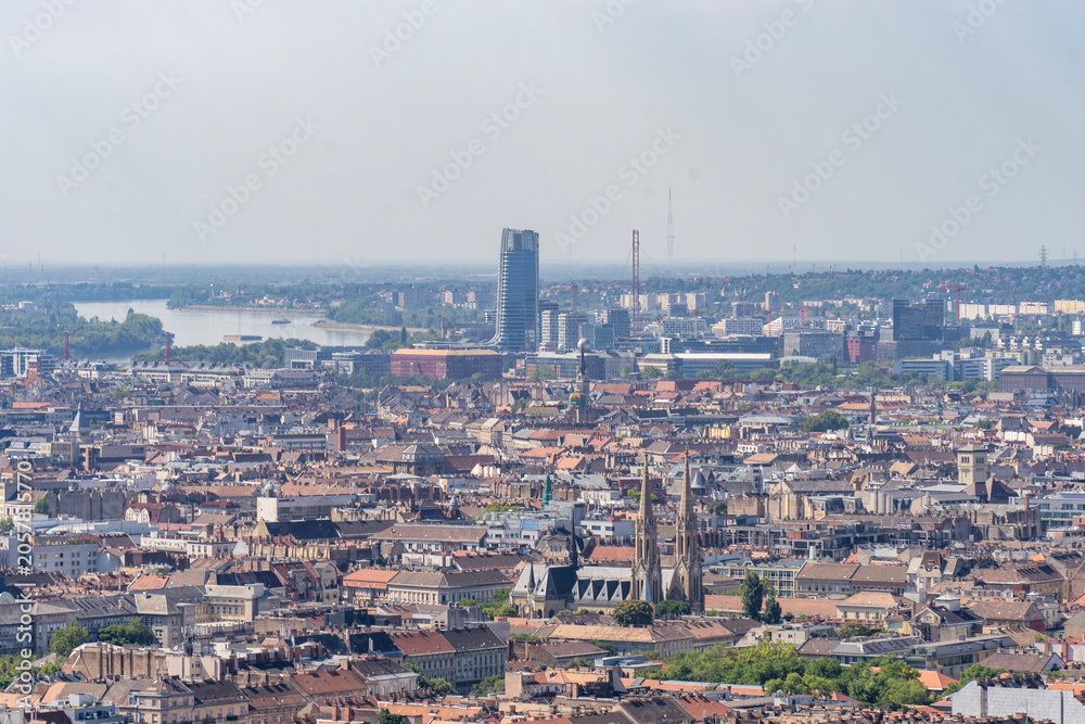 Obraz premium Panoramic cityscape of Budapest from the air with residential buildings and green areas