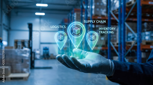 Warehouse worker holding digital holographic icons representing logistics, supply chain, and inventory tracking