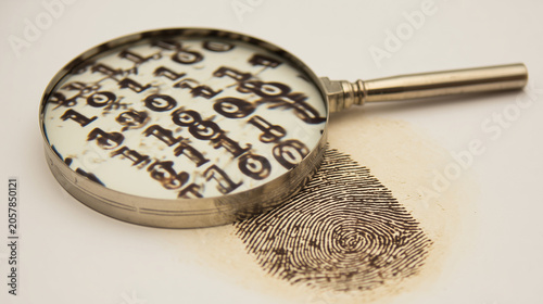 Conceptual image of a magnifying glass analyzing a fingerprint with binary code, representing cybersecurity, digital identity, forensic science, and data protection.