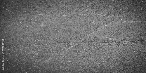 Quadro su tela Dark gray scratched asphalt road texture with cracks and rough granular surface grunge vector illustration