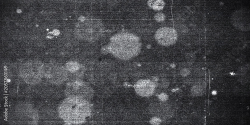 Dark grunge background texture with white dust, scratches, and grainy noisy overlay effect vector illustration.