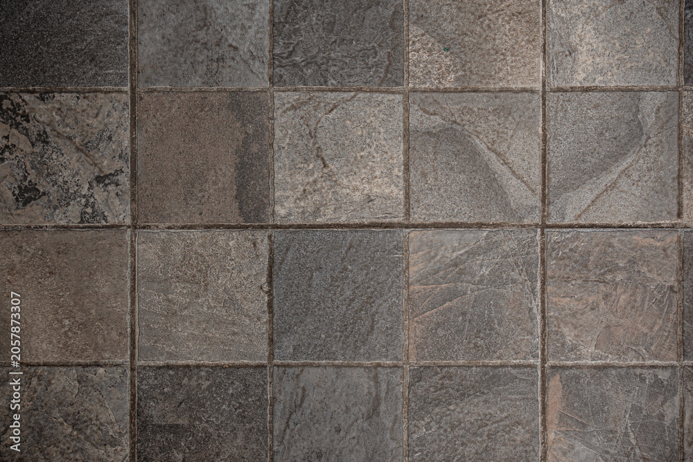 Fototapeta premium Rustic square slate floor tiles texture with grout lines. Grunge grey and brown stone background for architectural design.