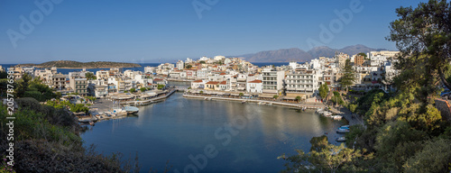 Agios Nikolaos on the island Crete, Greece, with Lake Voulismeni. Unidentifiable People in the distance