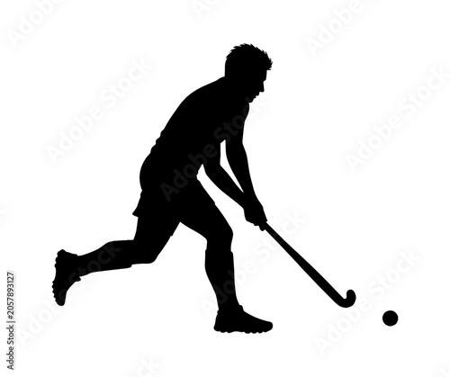 Silhouette of a field hockey player running with a stick and ball vector art