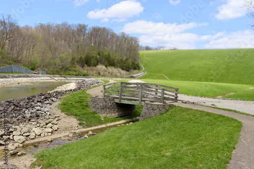 The wood bridge on the path on the park.