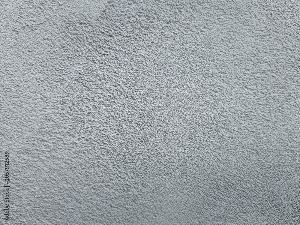 Fototapeta premium Fine grainy grey plaster wall texture background. Abstract soft concrete stucco surface backdrop.