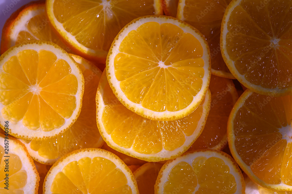 Fototapeta premium Bright, juicy orange slices arranged in a vibrant display ready for a refreshing snack or dessert