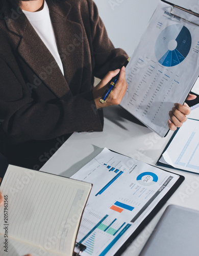 Accountants processing financial documents and taxes, managing corporate finance in a modern office. Audit and taxes in business