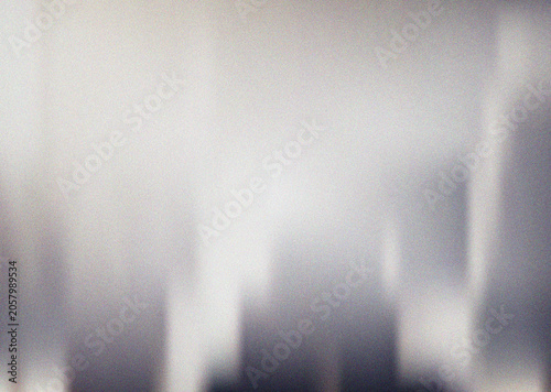 Abstract vertical light streaks cutting through a soft grainy gray gradient creating a unique modern textured background